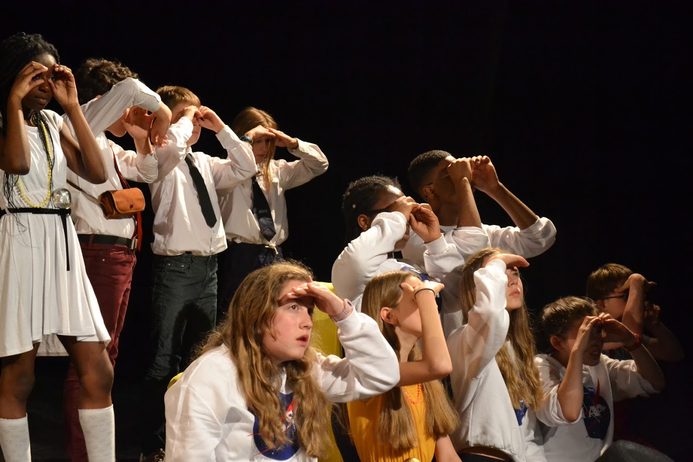 Large Group of Young people in a theatre performance