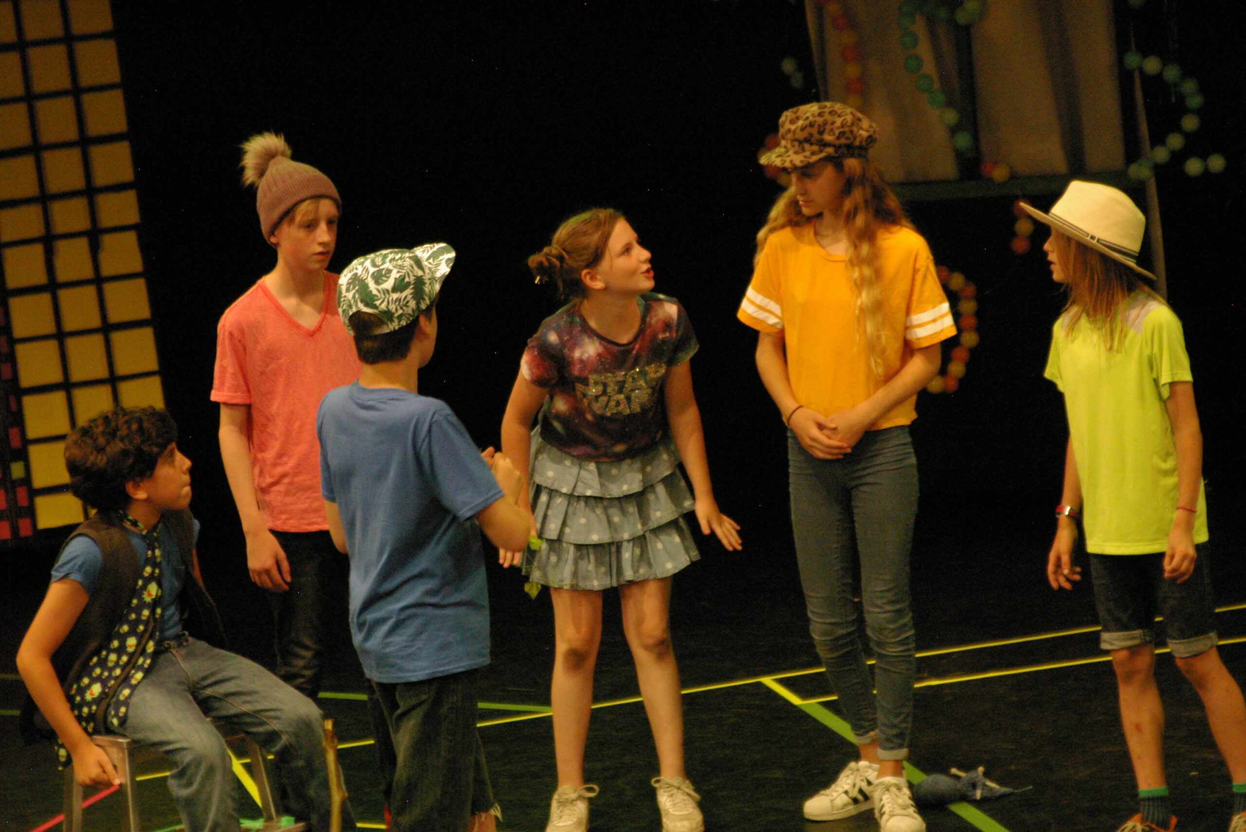 Group of young people performing theatre