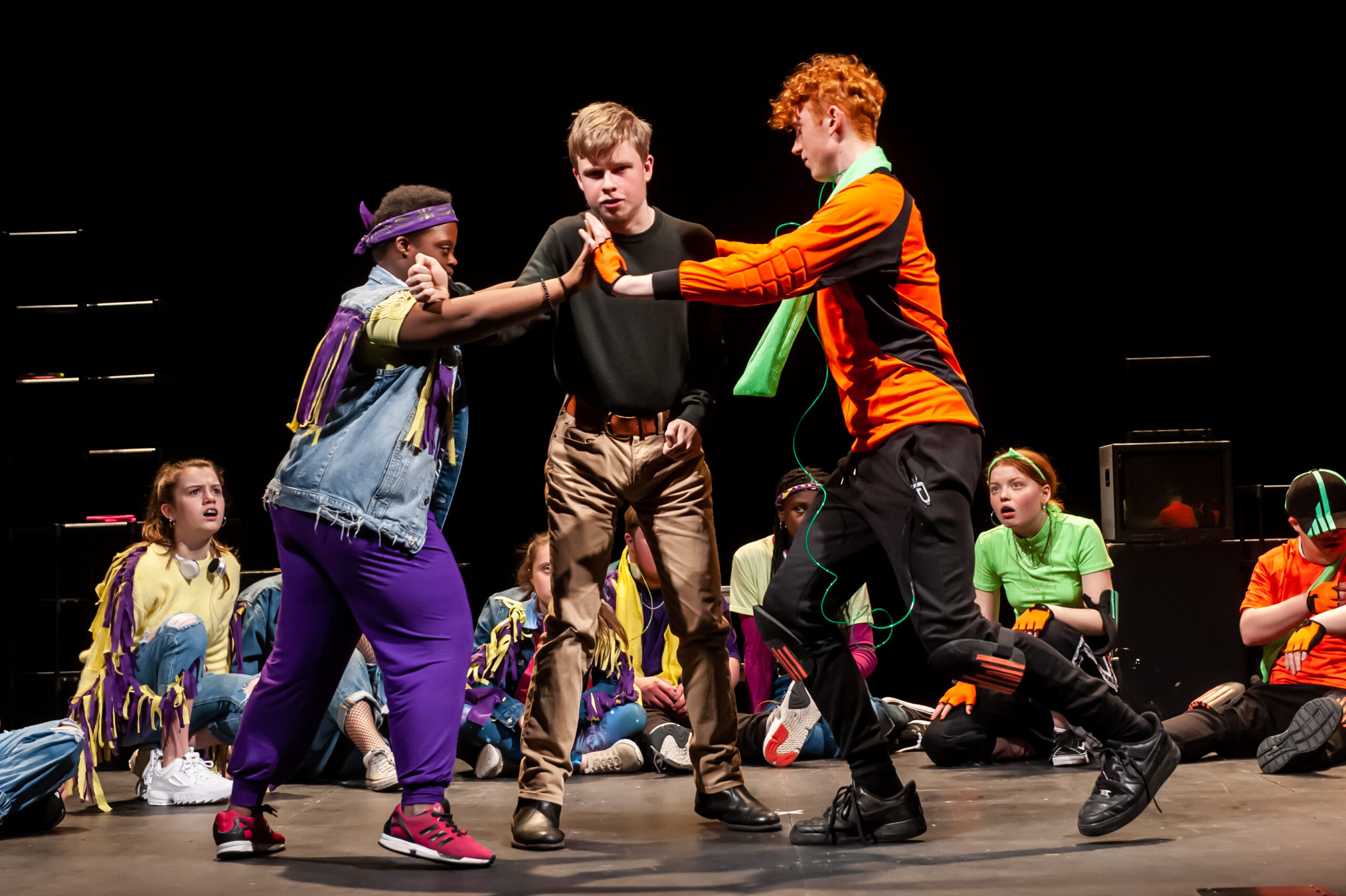 Group of Children performing in a theatre