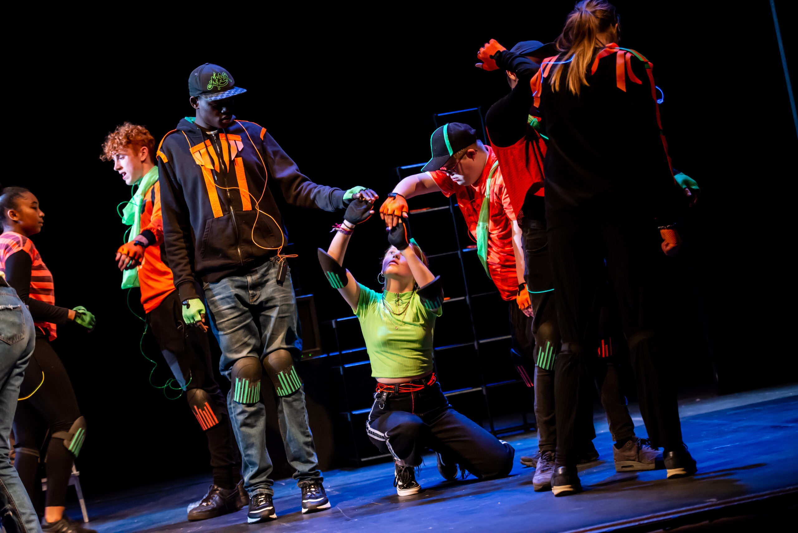 Group of Children performing in a theatre